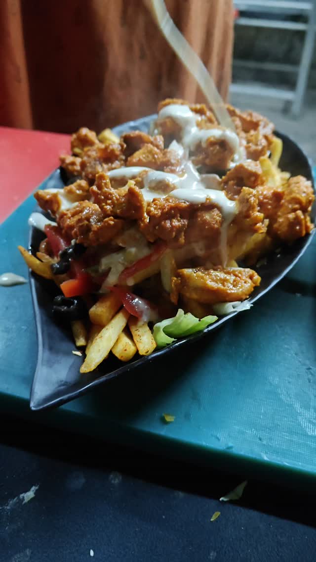 Fries with Benefits — loaded fries with grilled chicken at QnQ Cafe Sainikpuri